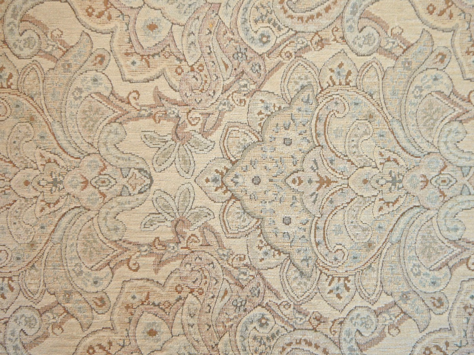 Pale beige chenille with blue-grey paisley, taupe curls and dusty rose floral details