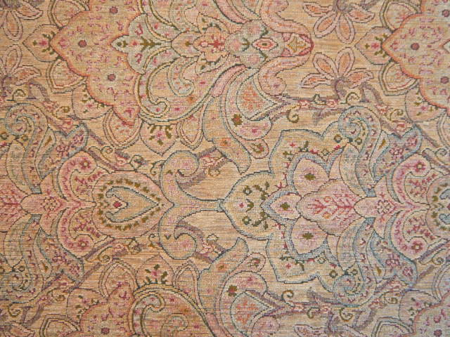 Muted beige chenille with pink, sage and blue-grey paisley scrolls
