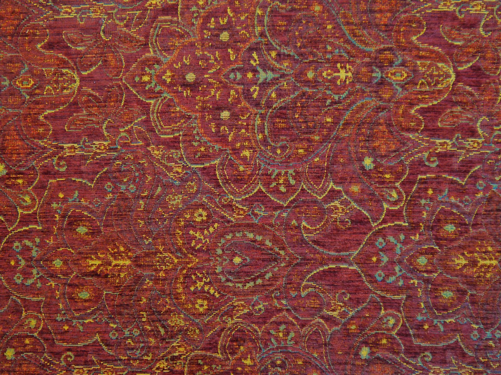 Burgundy chenille with ornate gold paisley, floral tracery and teal accents