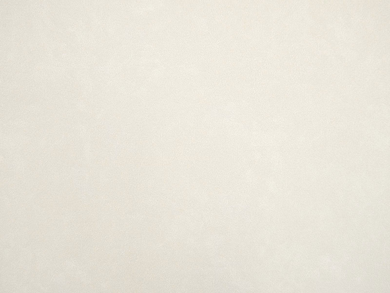 Warm ivory faux leather with a faintly mottled, softly textured surface