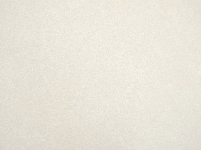 Warm ivory faux leather with a faintly mottled, softly textured surface