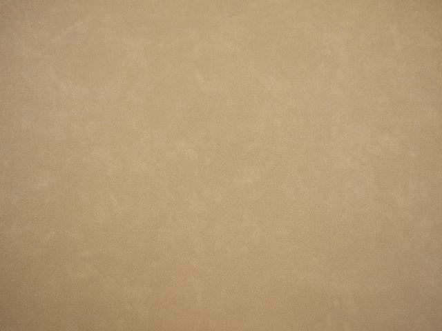 Warm taupe faux leather with subtle cloudy tonal variation and smooth surface