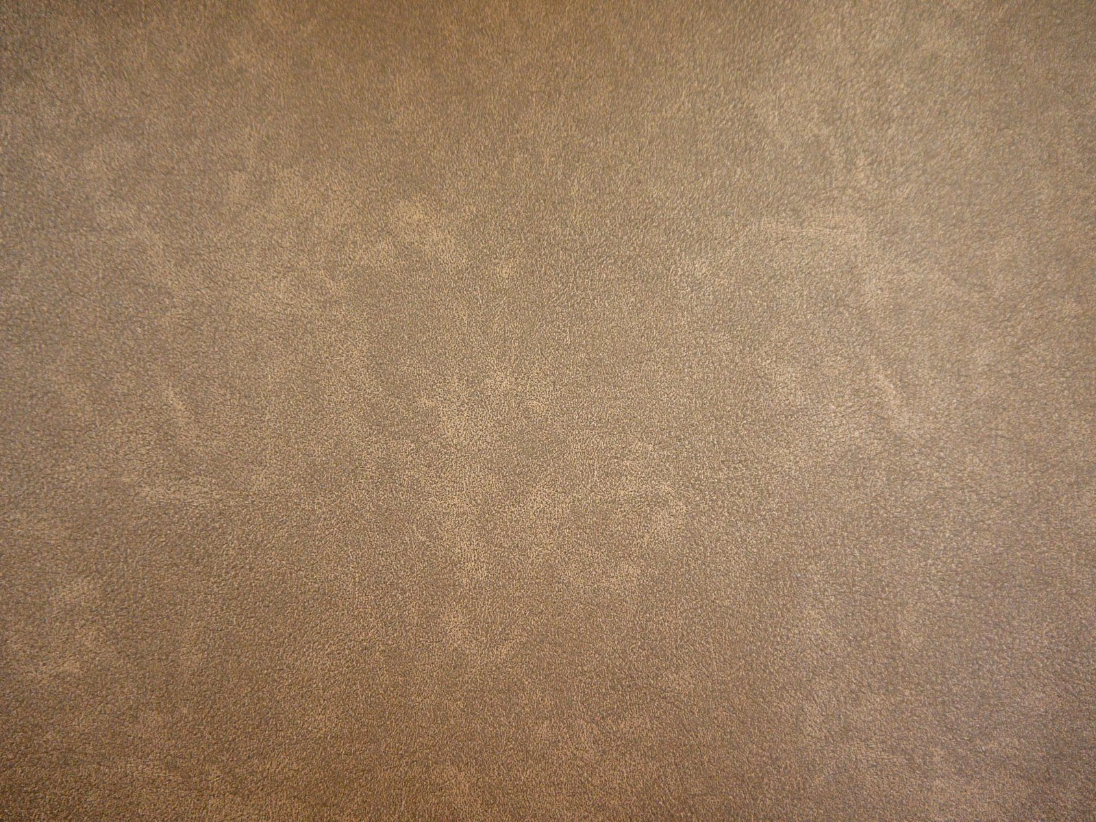 Warm mushroom-taupe faux leather with subtle cloudy mottling across the surface