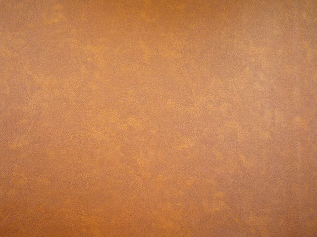 Warm caramel-brown faux leather with softly mottled copper and amber shading