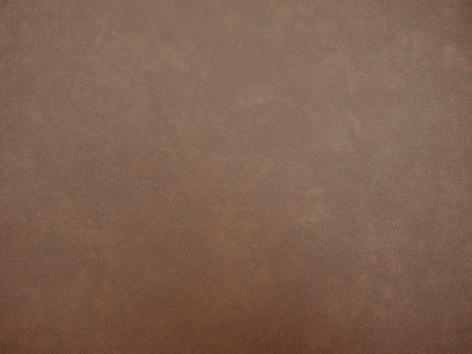 Warm mocha-taupe faux leather with softly mottled tonal shading