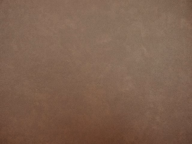 Warm mocha-taupe faux leather with softly mottled tonal shading