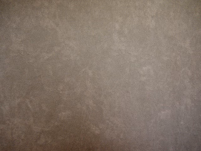 Mottled taupe-grey faux leather with softly cloudy tonal surface variation
