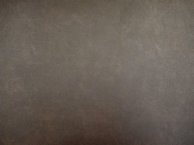 Smoky taupe-grey faux leather with fine pebbled grain and softly mottled shading