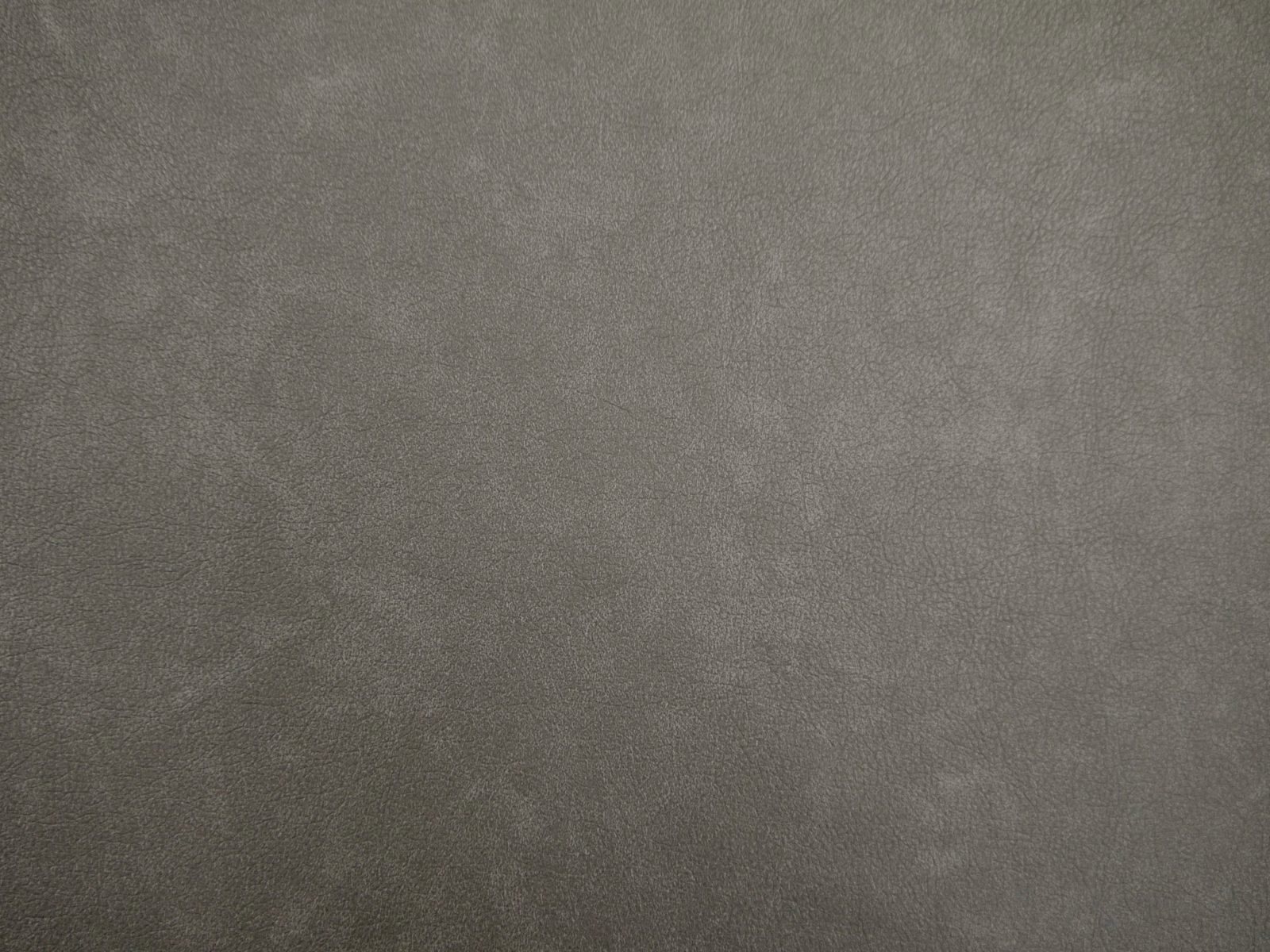 Muted taupe-grey faux leather with a softly cloudy, low-contrast surface texture