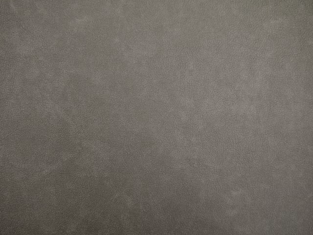 Muted taupe-grey faux leather with a softly cloudy, low-contrast surface texture