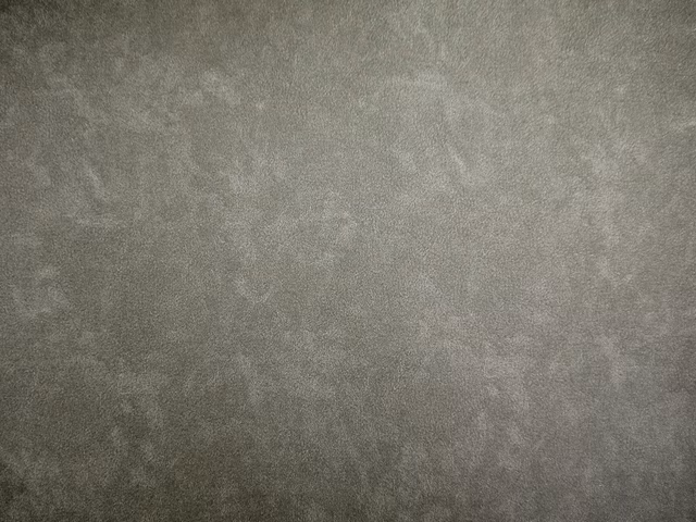 Softly mottled grey-taupe faux leather with a cloudy matte surface