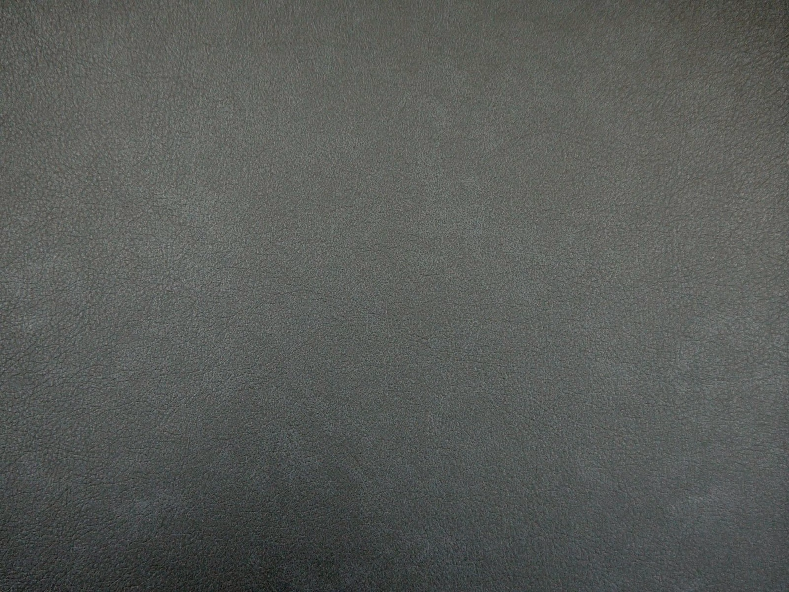 Deep charcoal grey faux leather with a subtle pebbled, softly mottled surface