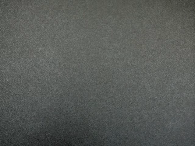 Deep charcoal grey faux leather with a subtle pebbled, softly mottled surface
