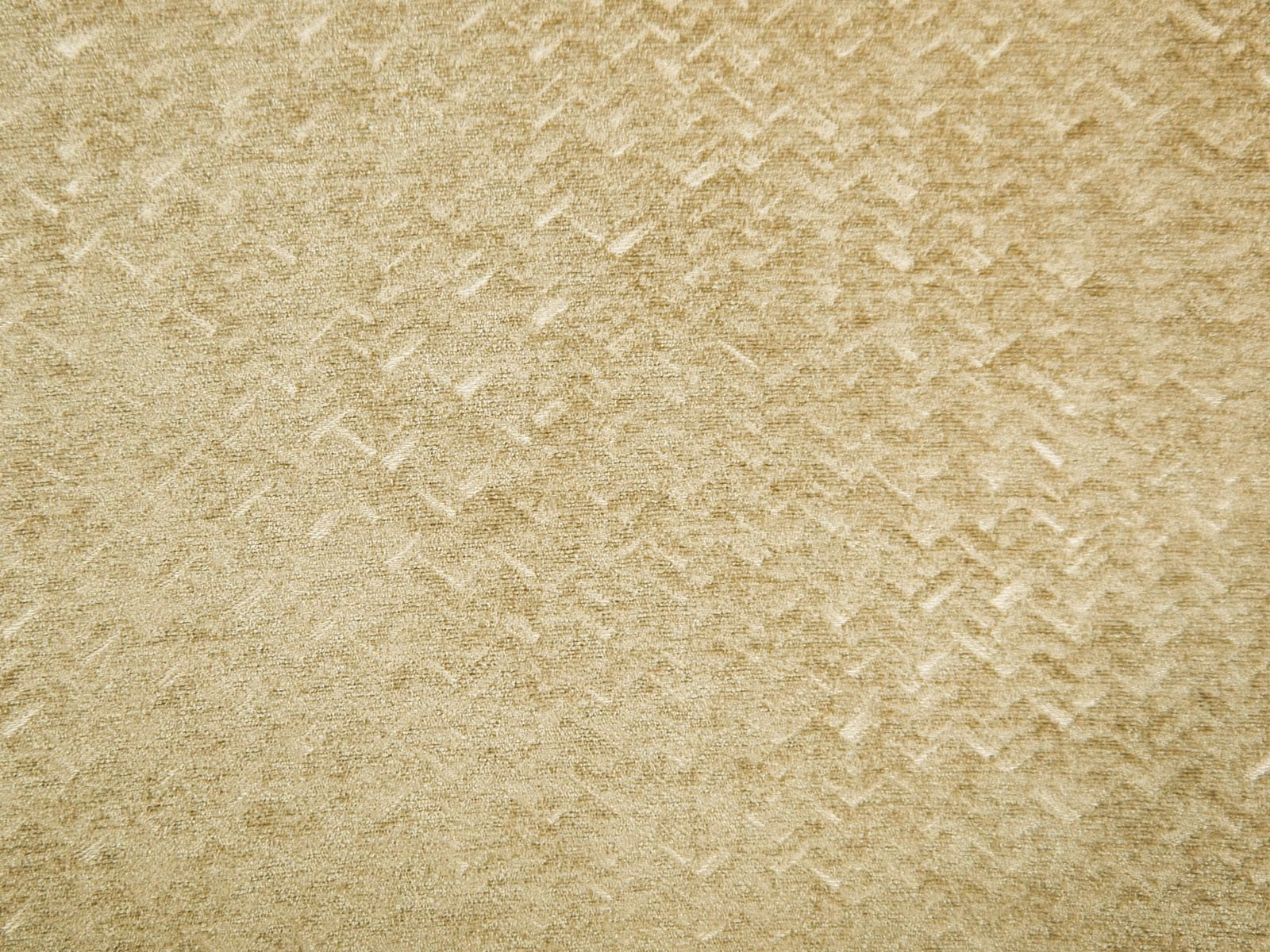 Warm beige-gold chenille with softly broken chevron markings and a tactile mottled pile
