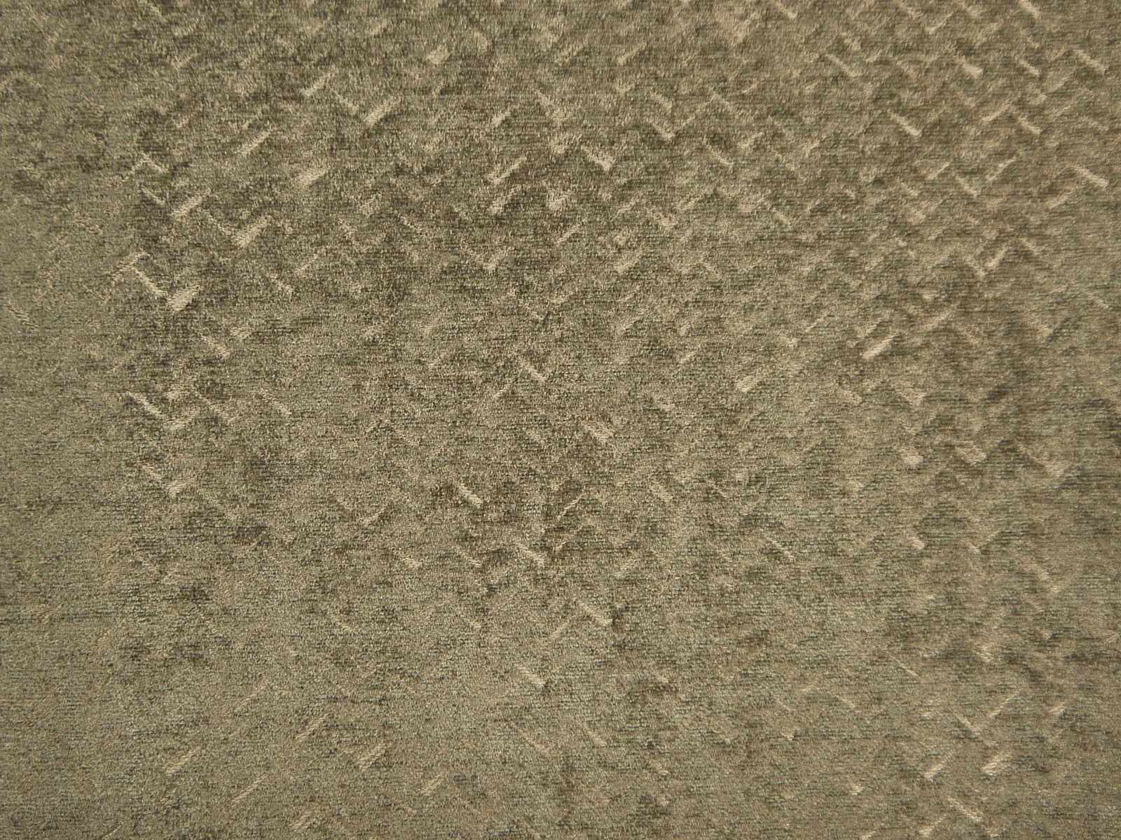 Muted olive-grey chenille with mottled texture and scattered pale angular flecks