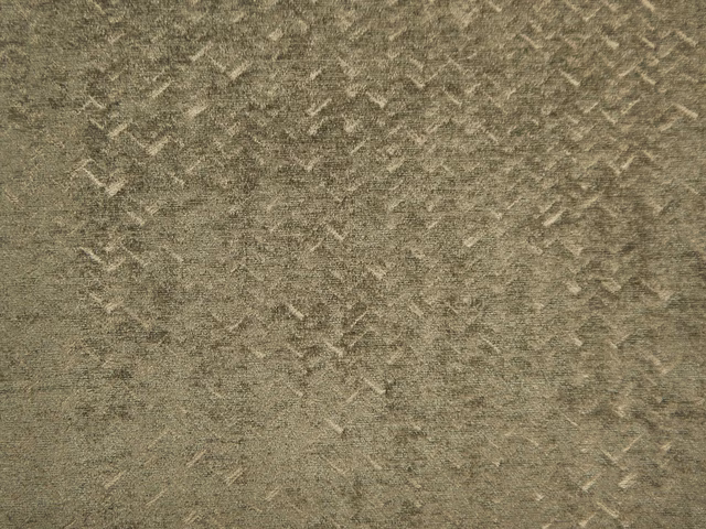 Muted olive-grey chenille with mottled texture and scattered pale angular flecks