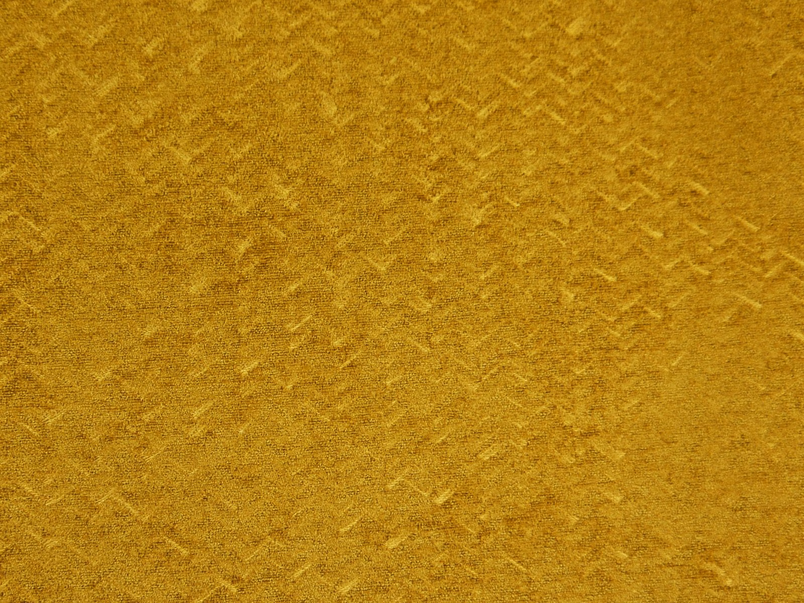 Ochre-gold chenille with softly mottled, brushed texture and subtle directional nap