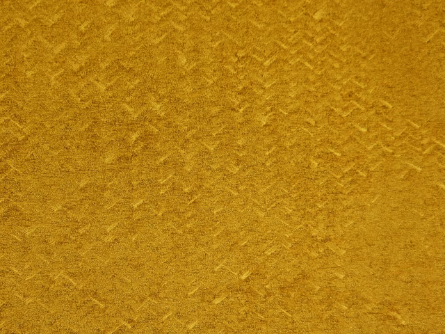 Ochre-gold chenille with softly mottled, brushed texture and subtle directional nap