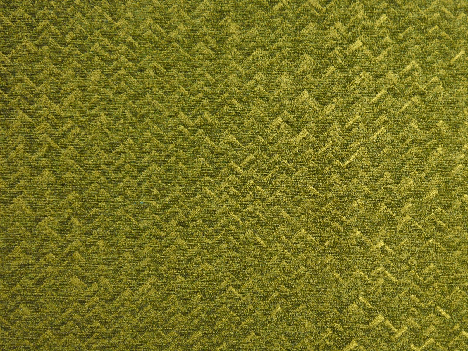 Deep olive chenille with mottled yellow-green chevrons and a tactile pile