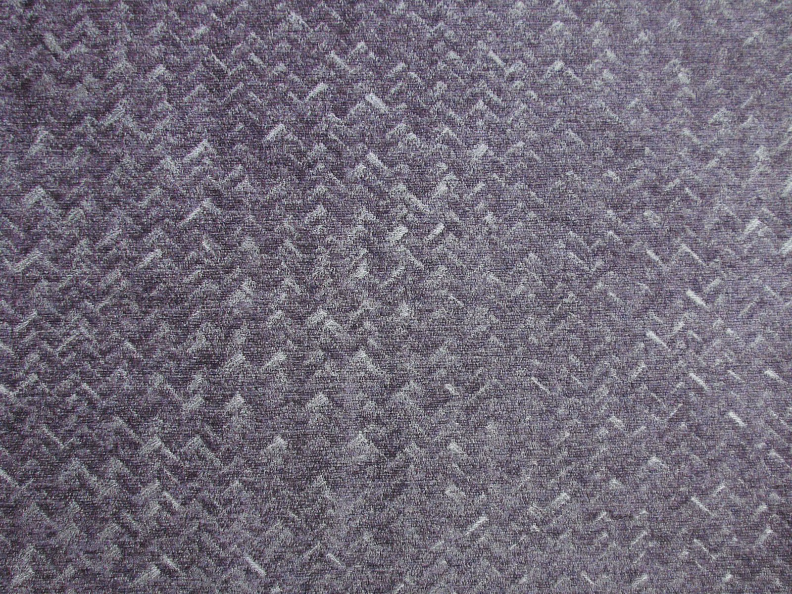 Muted mauve-grey chenille with a close, irregular chevron weave and softly mottled texture