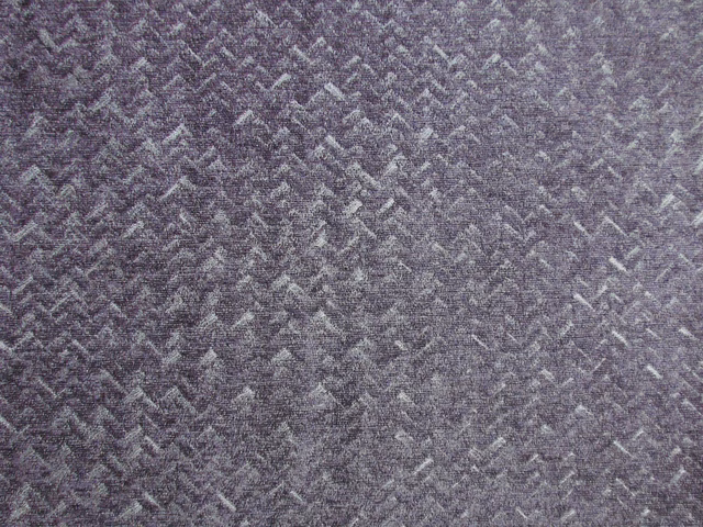 Muted mauve-grey chenille with a close, irregular chevron weave and softly mottled texture