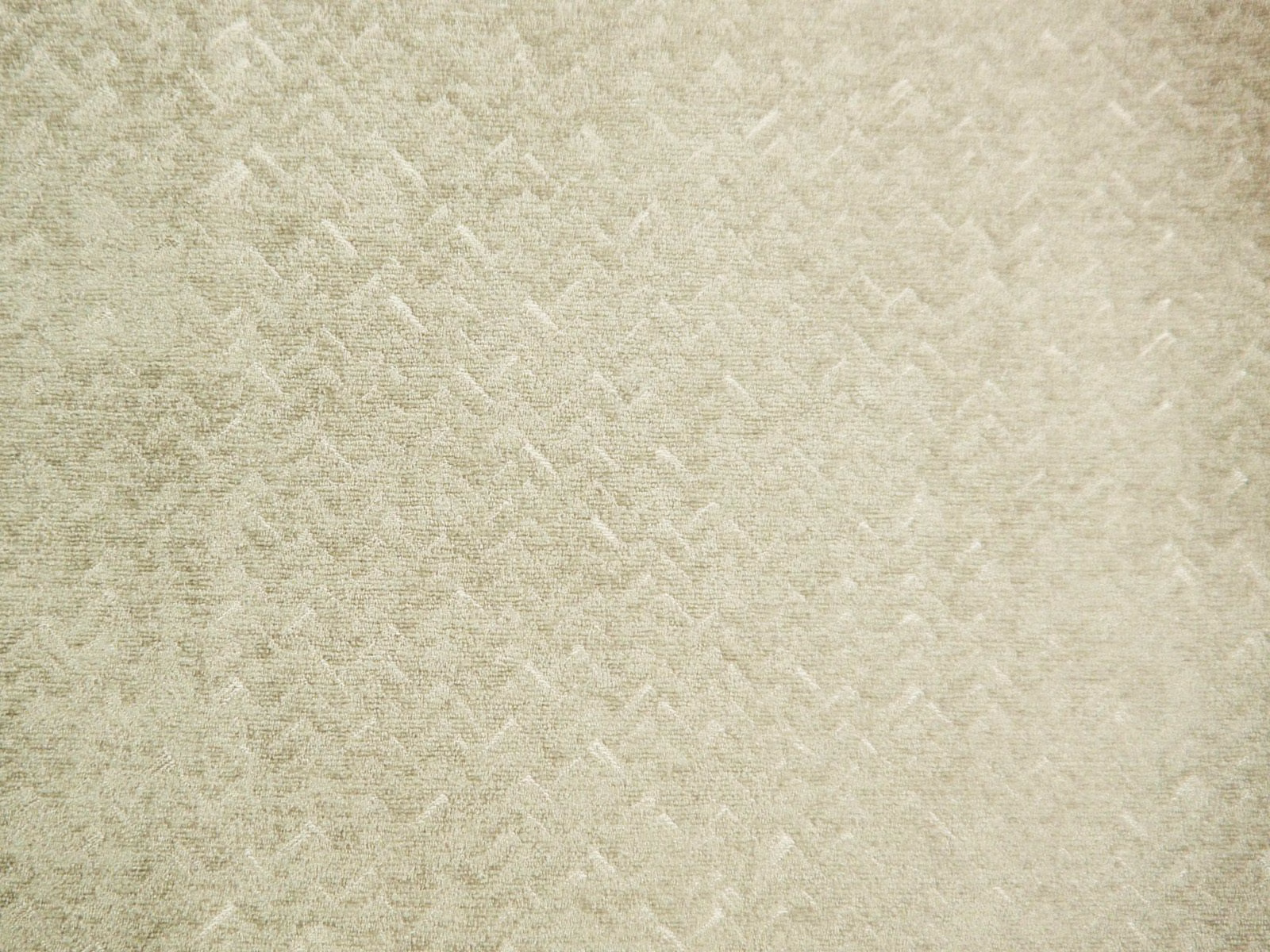 Pale ivory chenille with broken tonal chevrons and a softly brushed surface