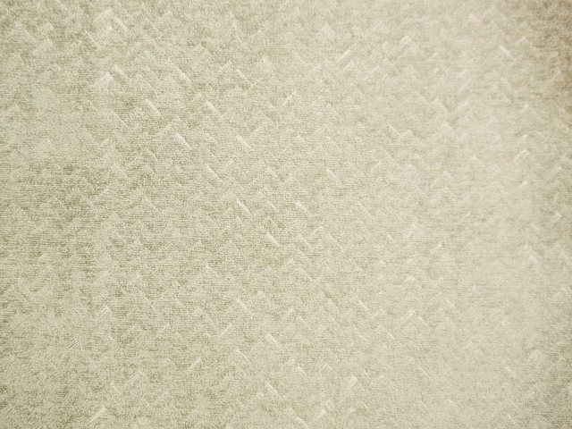 Pale ivory chenille with broken tonal chevrons and a softly brushed surface