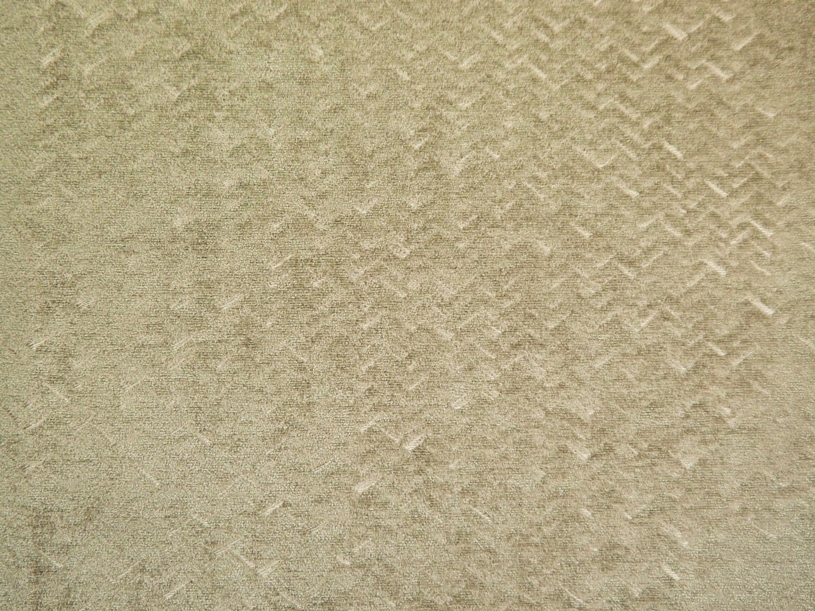 Muted sage-olive chenille with subtle broken chevron texture and softly mottled pile