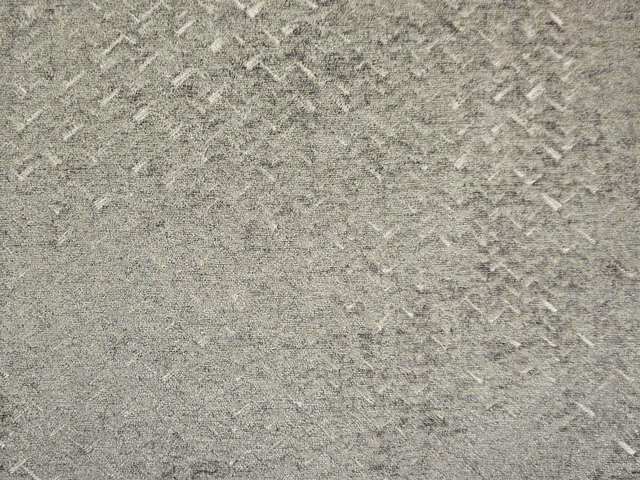 Mottled stone-grey chenille with fine pale diagonal flecks and softly raised texture