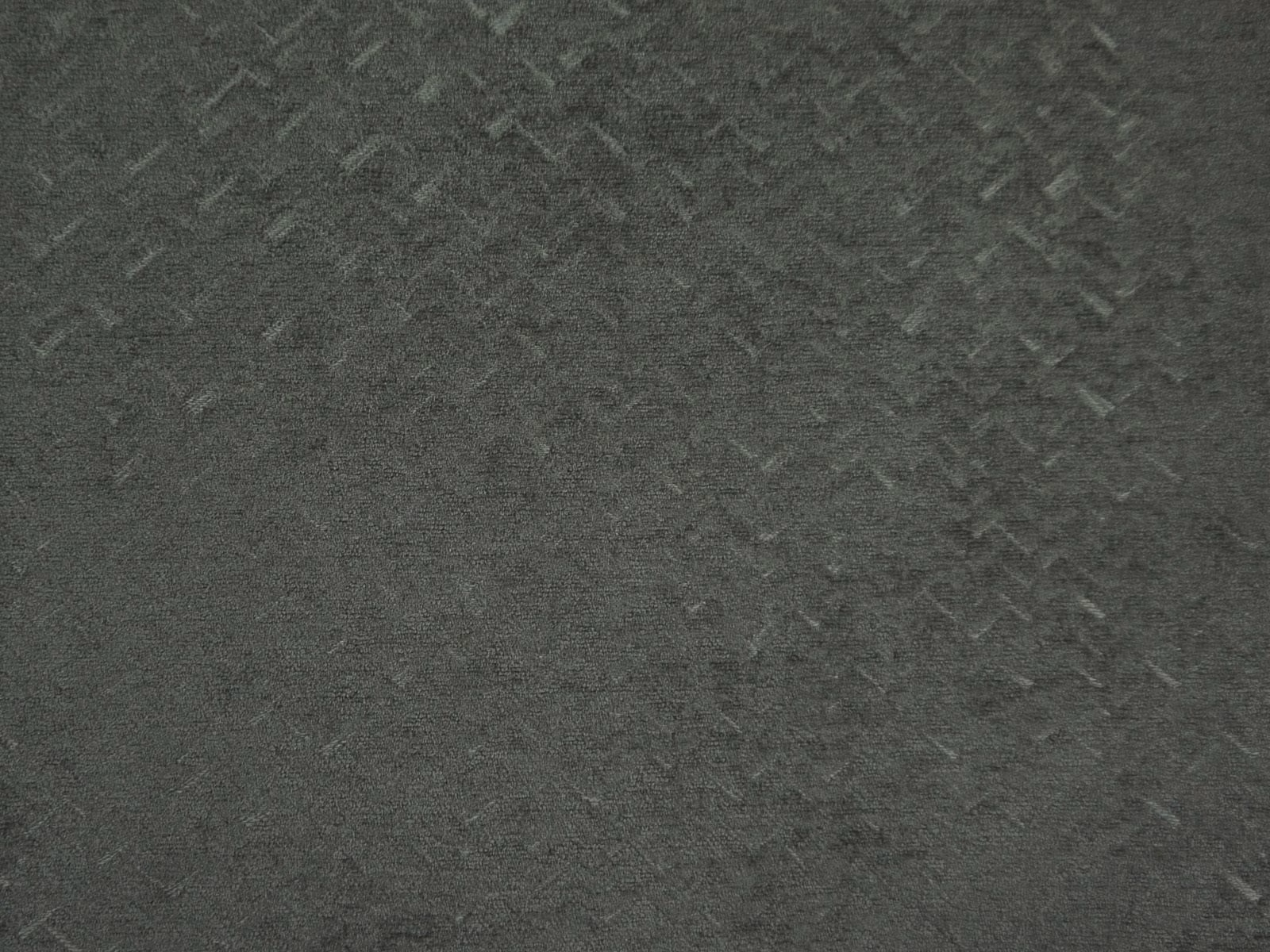 Deep charcoal-grey chenille with subtle angular marks and a softly brushed surface