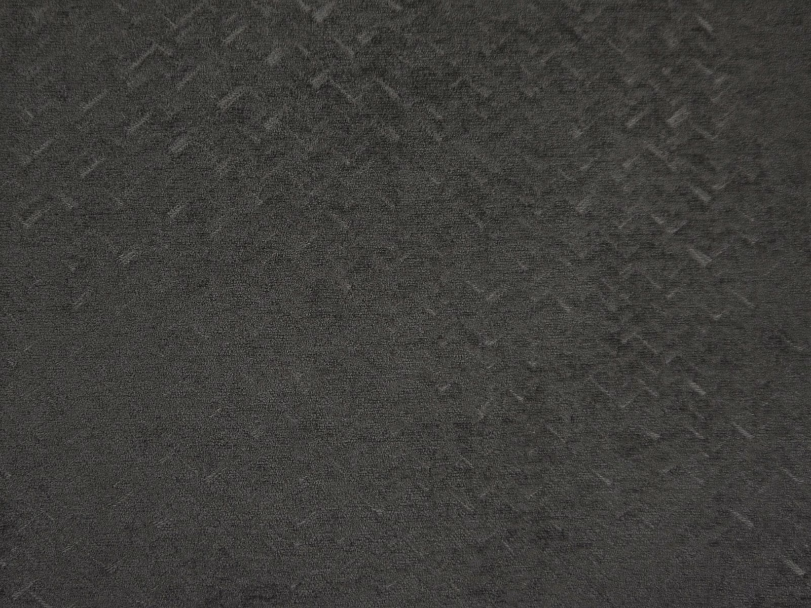 Deep charcoal chenille with subtle grey flecks and a softly mottled woven texture