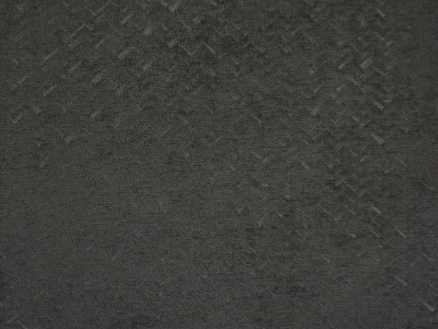 Deep charcoal chenille with subtle grey flecks and a softly mottled woven texture