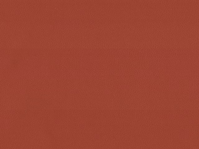 Muted brick-terracotta faux leather with a fine, lightly pebbled grain