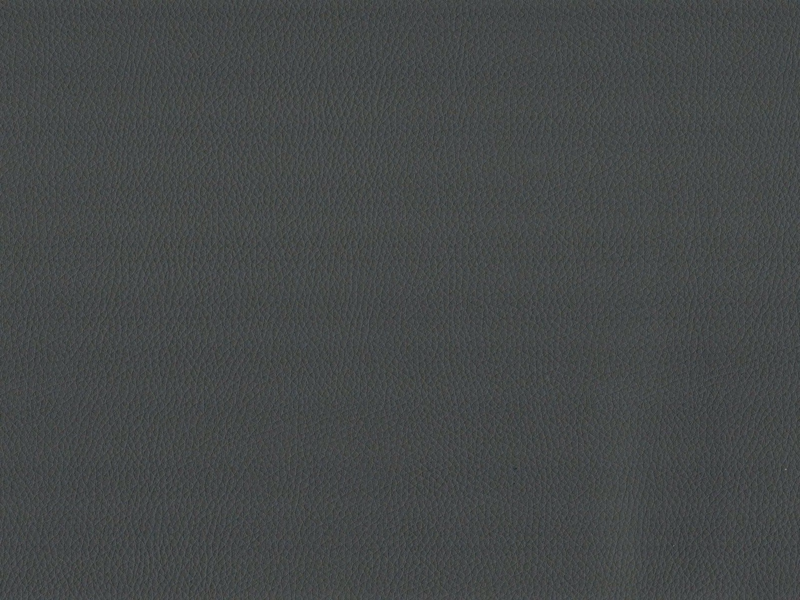 Close-up of charcoal grey faux leather with a fine pebbled grain and low sheen