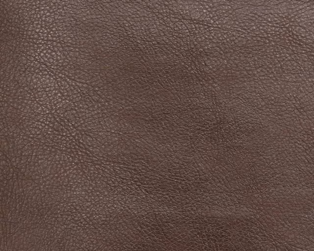 Deep warm brown faux leather with fine, irregular pebbled grain and subtle tonal variation