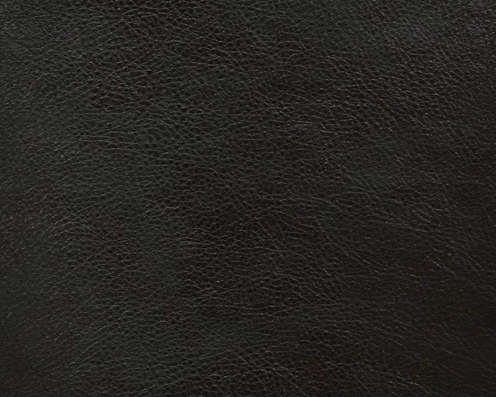 Close-up of charcoal-black faux leather with a fine irregular pebbled grain