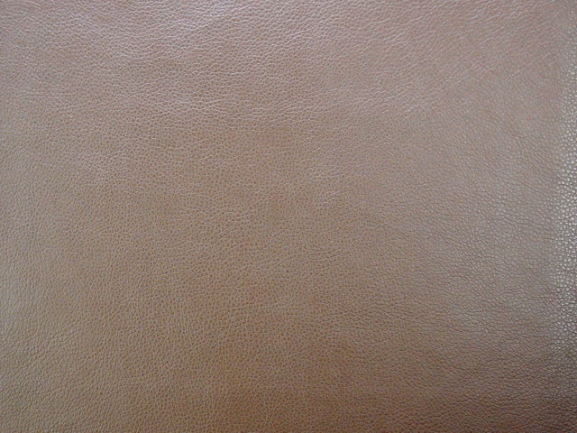 Warm taupe-grey faux leather with a fine, even pebbled grain
