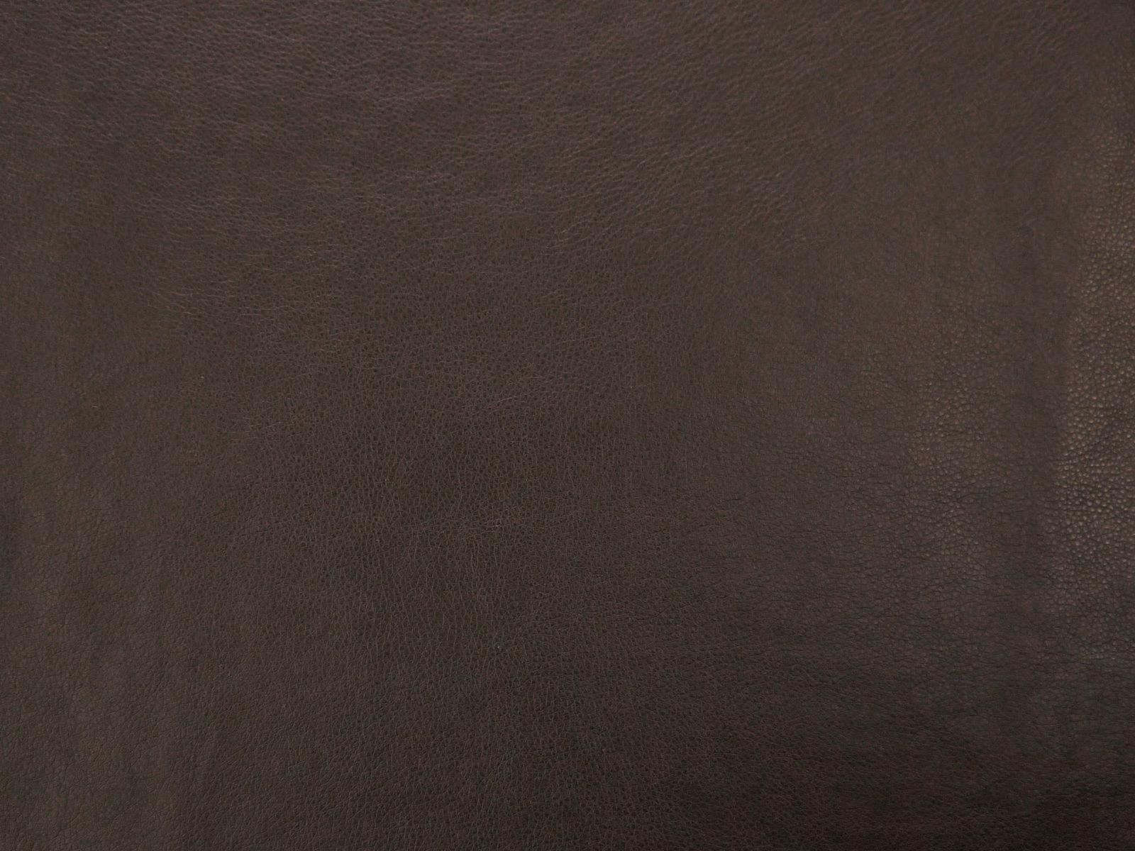 Dark brown faux leather with a subtle pebbled grain and soft tonal shading