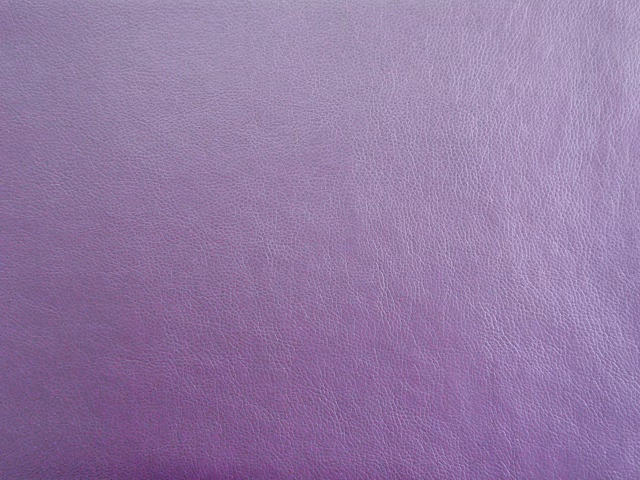 Dusty lilac purple faux leather with a fine pebbled grain and subtle tonal sheen