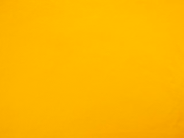 Vivid golden-yellow faux leather with a subtle, even fine-grain surface