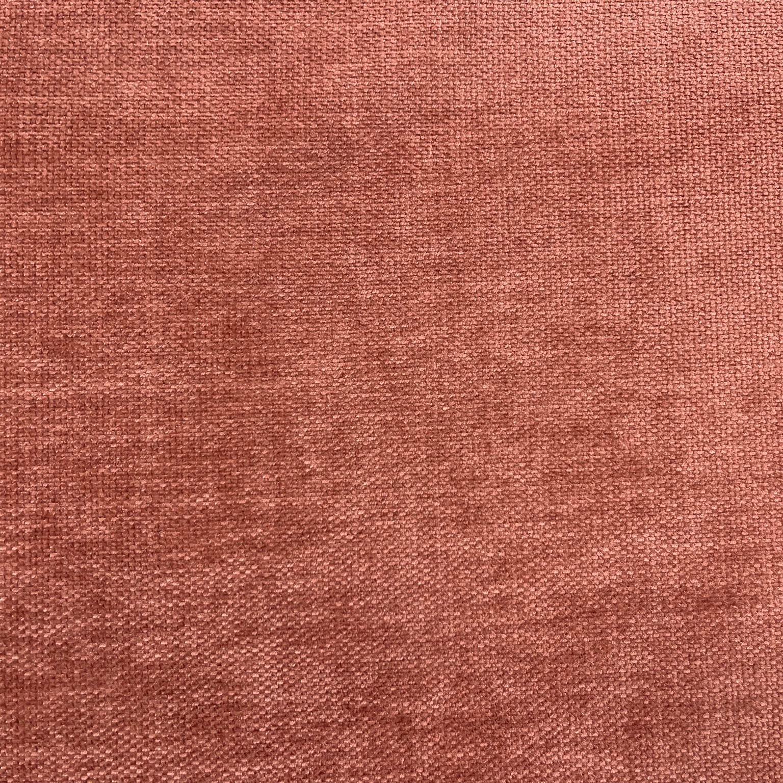 Dusty rose terracotta chenille with mottled woven texture and subtle tonal bands