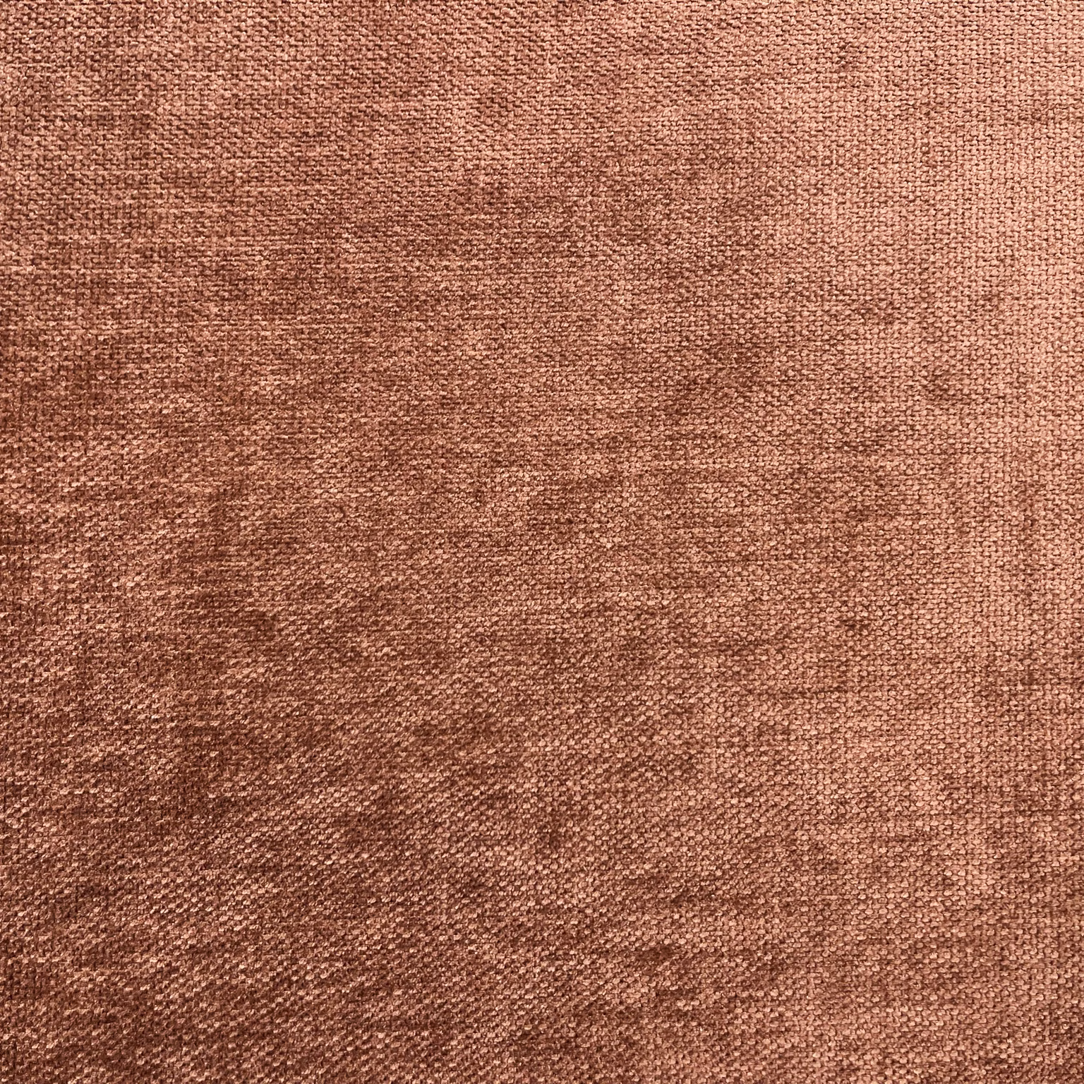 Muted terracotta-brown chenille close-up with fine weave and softly mottled tonal shading