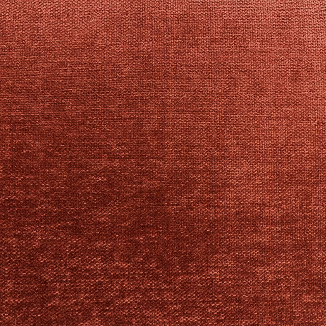 Deep brick-red chenille with softly mottled weave and darker tonal texture
