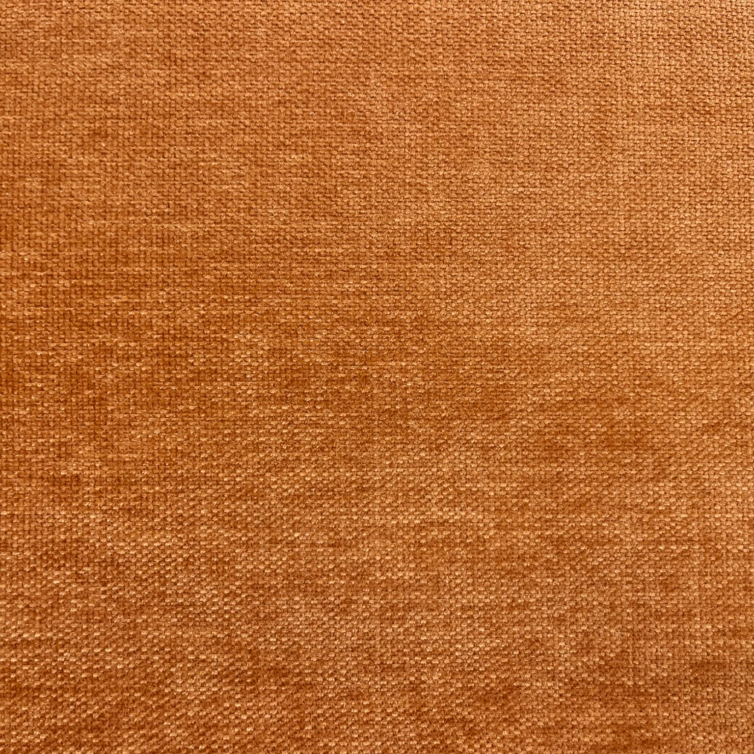 Warm rust chenille with nubby woven texture and subtle darker russet flecks