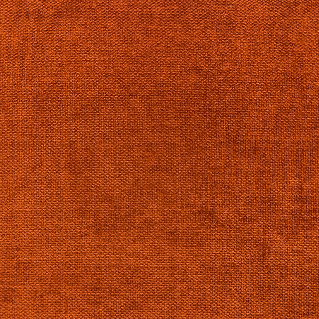 Close-up of burnt-rust orange chenille with a softly mottled woven surface
