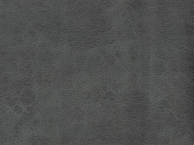 Charcoal-grey faux leather with fine branching crackle lines and a cool green undertone