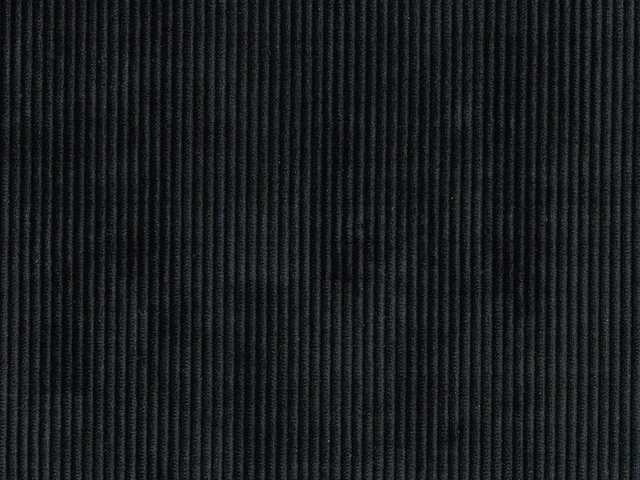 Close-up of deep charcoal-black fabric with fine, closely spaced vertical ribs