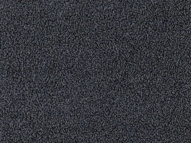 Deep charcoal grey fabric with dense peppered nubby texture and subtle tonal flecks