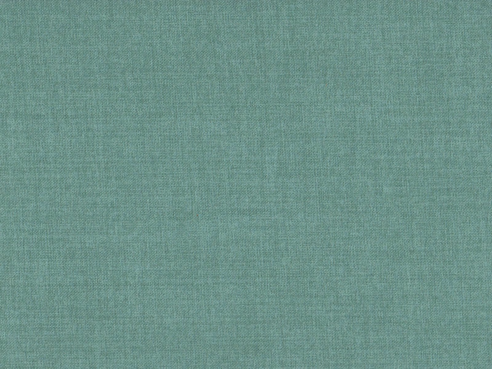 Close-up of muted seafoam teal fabric with a fine tonal flat-weave texture