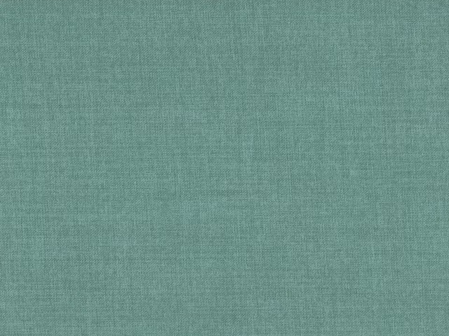Close-up of muted seafoam teal fabric with a fine tonal flat-weave texture